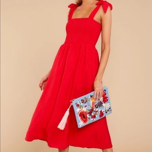 Red smocked midi dress with tie straps